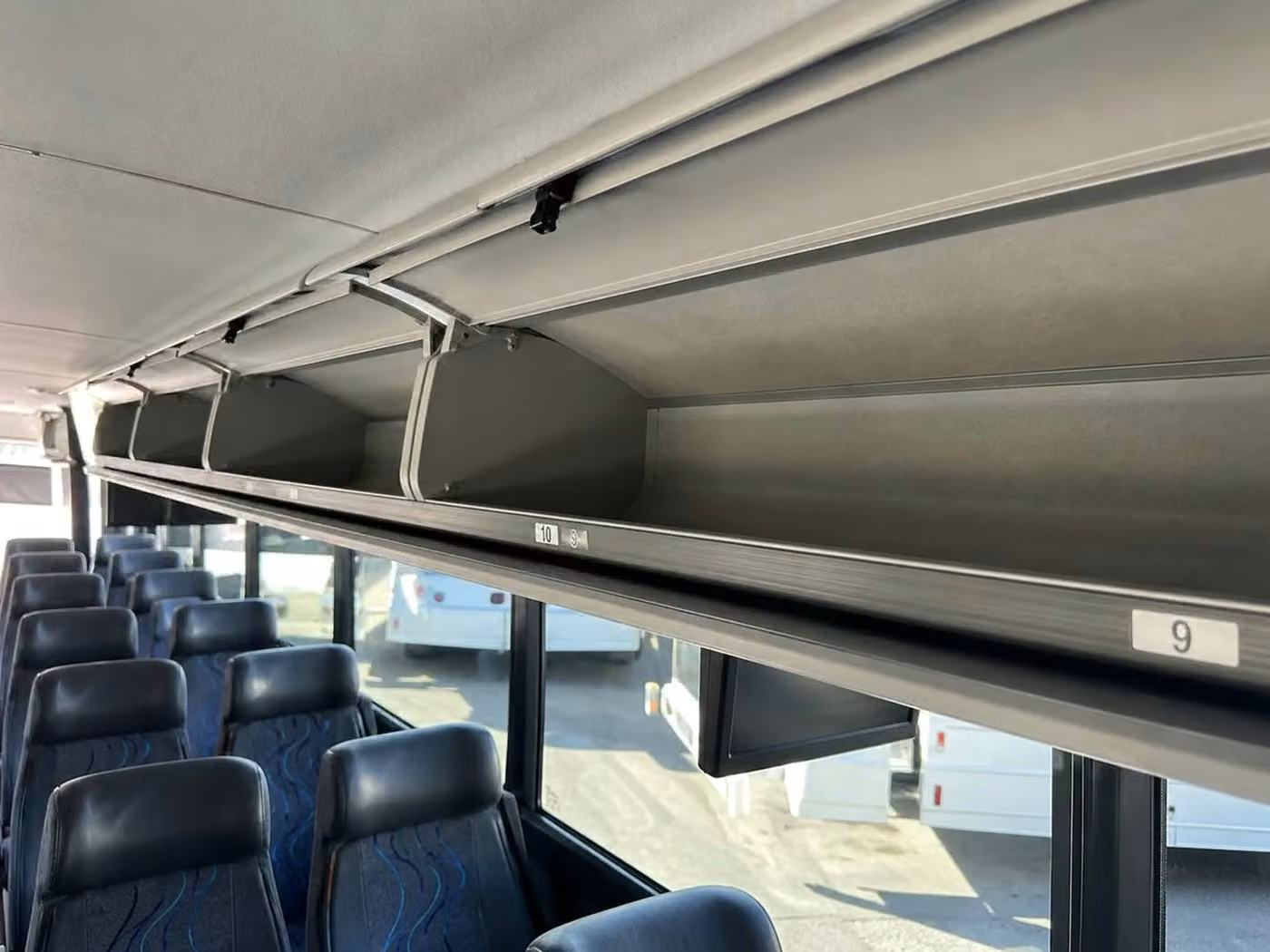 claremont 25 passenger minibus overhead storage